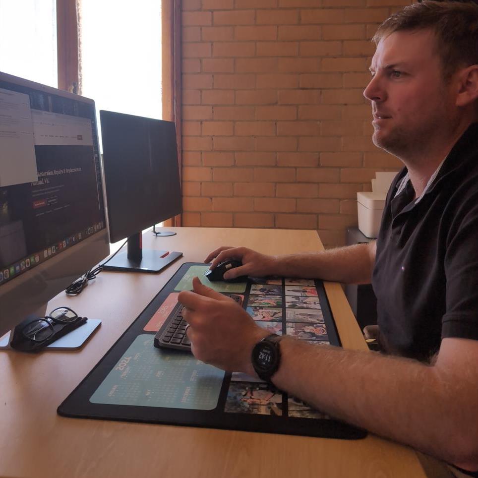 Jai Blackley, founder of IRON Digital Solutions, at his desk in Portland VIC